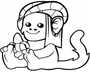 un singe mignon en turban avec une banane dessin à colorier