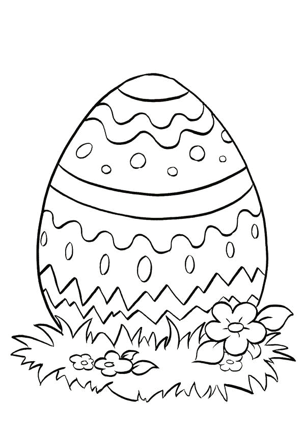 Coloriage Œuf de Pâques décoré dans l'herbe - Pâques à imprimer