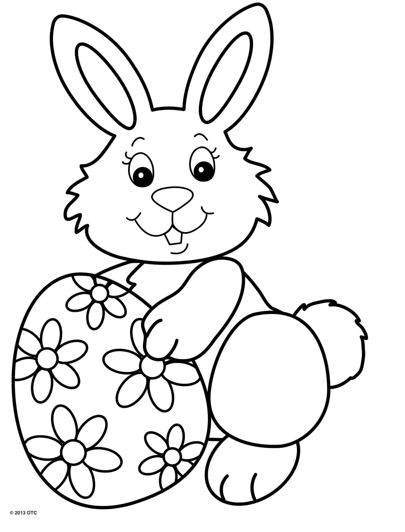 Coloriage Jolie Lapin Souriant Avec Un Œuf De Pâques Motif Fleurs - Pâques facile à imprimer